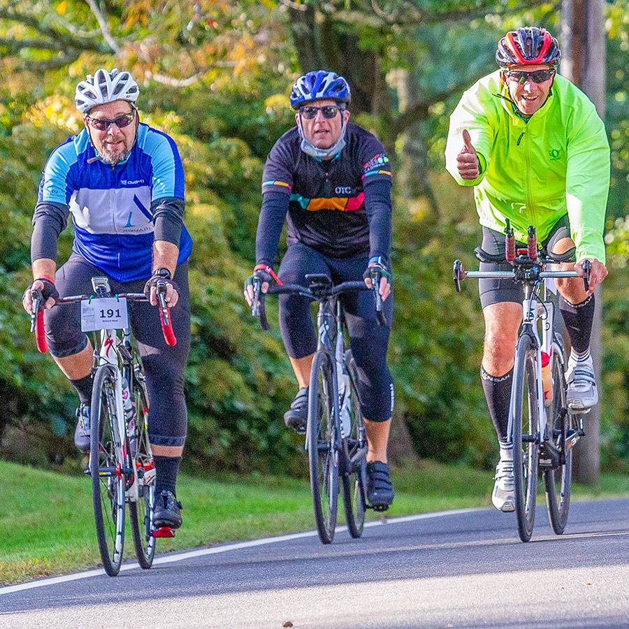 Members of team AquaBlue and OTC Markets share the roads in friendly competition while raising funds for autism research.