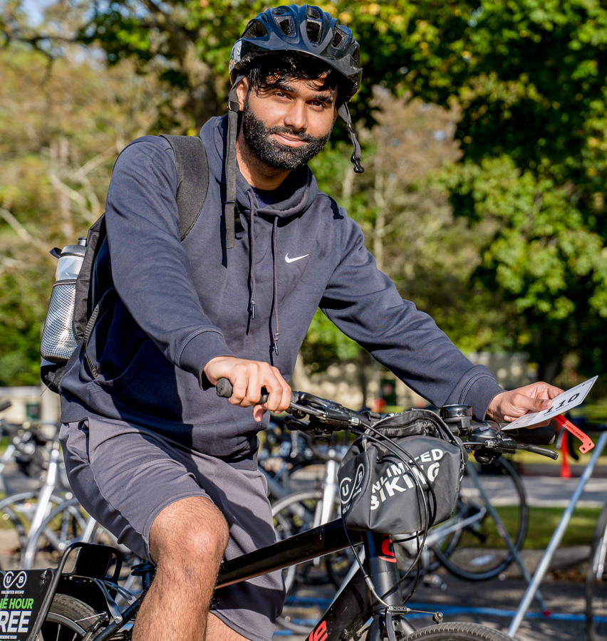 A happy rider takes his rental bike from Unlimited Cycling on a test spin before he heads out onto the beautiful route to support autism research.