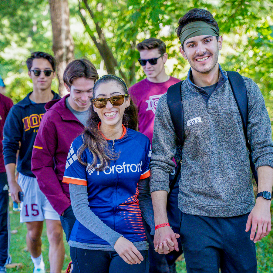Walkers, led by members of team Forefront, head into the woods on our family friendly 5k trail hike.